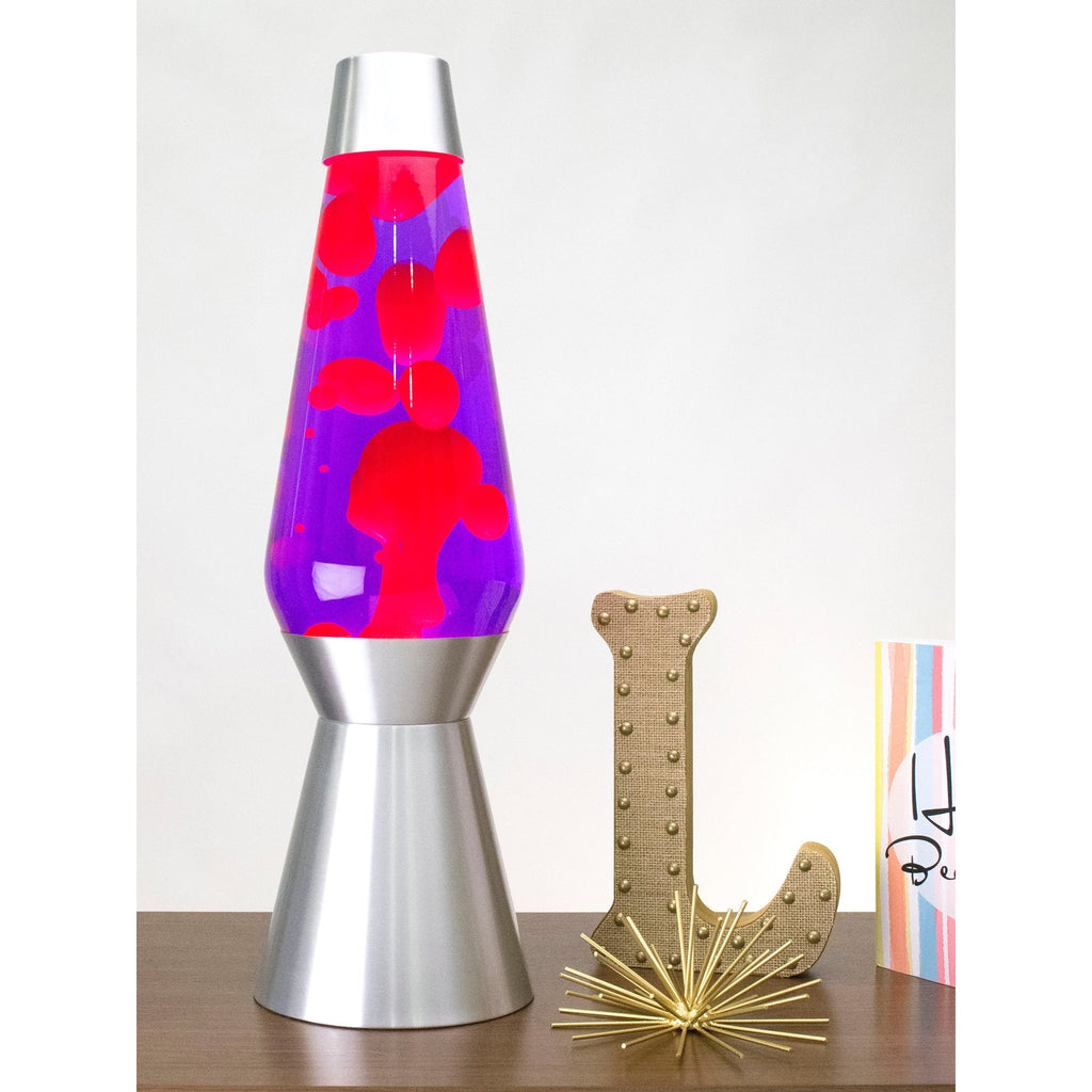 27" LAVA� Lamp Grande - Pink/Purple/Silver on a table with knick knacks
